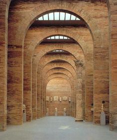 an old building with arches and windows in it