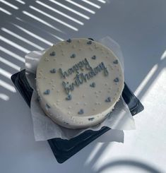 a birthday cake with the words happy birthday on it