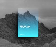 a book sitting on top of a mountain covered in fog and clouds with the title punca jaja