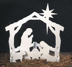 a nativity scene with the birth of jesus and baby jesus in a manger