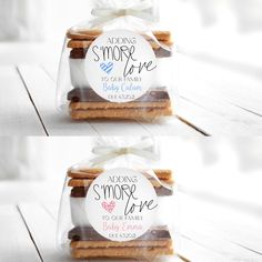 two bags filled with cookies sitting on top of a wooden table next to each other