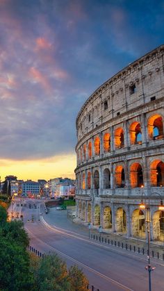 the roman colossion is lit up at night with bright lights on it's windows