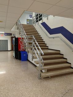 there is a set of stairs leading up to the second floor in an empty building