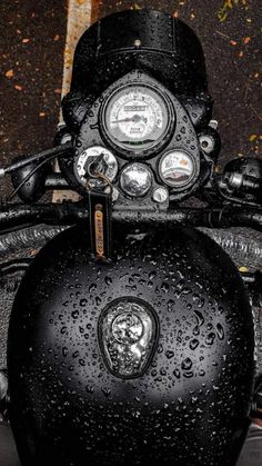 the front view of a motorcycle with rain drops on it