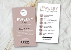 a pink and white business card with the words jewelry on it next to some dry grass