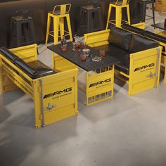 yellow tables and stools with black leather seats