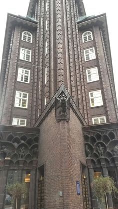 a tall brick building with many windows