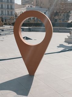 a large metal object sitting on top of a cement ground