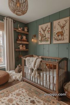 a baby's room with green walls and pictures on the wall