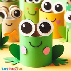 some very cute little green and yellow paper crafts with googly eyes on it's faces