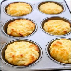 a muffin tin filled with cooked biscuits