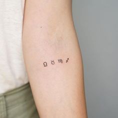 a woman's arm with the word love tattooed on it