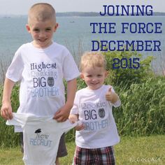 two young boys standing next to each other holding t - shirts with the words, joining the force december 2013