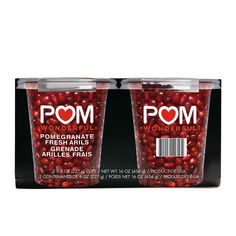 two plastic cups filled with pomegranate on top of each other