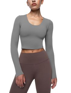 PRICES MAY VARY. Cream Collection Top: Crop tops are made from soft fabric that feels cream smooth on your skin. They are lightweight, breathable, quick-drying, moisture-wicking and resistant to sweat stains brings you the best sports experience. Removable Padding Bra: Yoga crop tops for women feature an inner removable cups with hidden small opening on both sides, easy to clean and adjust. The pad cups provide support and shock protection. U Neck Design: Athletic shirts tops cut with flattering Gray Seamless Long Sleeve Top, Gray Stretch Tops For Yoga, Seamless Long Sleeve Workout Tops, Solid Scoop Neck Top For Pilates, Scoop Neck Tops For Pilates, Gray High-stretch Yoga Top, Versatile Seamless Gray Tops, Versatile Gray Seamless Tops, Versatile Gray Seamless Top