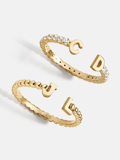 Our 18K Gold Double Initial Custom Ring is an updated take on a classic initial accessory. Available in an all-gold and a subtle sparkly version, these rings are ones you'll have for years to come. Add your own initials or that of you and a loved one to create a keepsake you'll cherish. Not to mention, this ring is crafted with 18K gold plated sterling silver and Cubic Zirconia stones. Matching Sister Rings, Non Tarnish Gold Rings, Cute Jewelry Aesthetic, Gold Rings Women, Senior Ring, Senior Rings, Good Rings, Wishlist For Christmas, Jewelry Stack