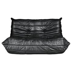 a black leather futon couch on a white background