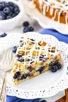 a slice of blueberry cheesecake on a white plate