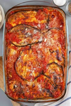 a casserole dish filled with meat and sauce