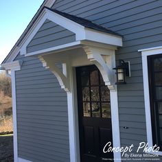 a gray house with a black door and white trim