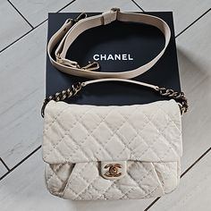 Beautiful Chanel Quilted Dark White Leather Flap Bag With Chain Link Top Handle And Detachable Adjustable Crossbody Strap. Turnlock Closure With Super Clean Tan Fabric Interior With Leather Key Clip, Zip Pocket, And Two Slip Pockets. In Beautiful Condition With Some Darkening Where The Strap Attaches But Not Noticeable When Wearing. Comes With Box, Authenticity Card, And Original Price Tag. Absolutely Authentic And Part Of My Personal Collection So Not In A Rush To Sell Designer Cream Satchel With Gold-tone Hardware, Luxury Cream Shoulder Bag With Chain Strap, Cream Square Bag With Gold-tone Hardware, Luxury Cream Bags With Gold-tone Hardware, Chanel Cream Bag, Key Clip, Leather Key, Cream And Gold, Flap Bag