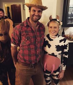 a man and woman in costumes standing next to each other