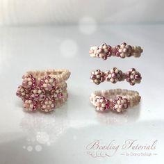 three pieces of beaded jewelry sitting on top of a white table next to each other