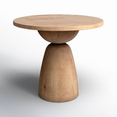 a wooden table sitting on top of a white floor