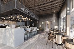 the inside of a restaurant with wooden floors and tables, chairs, and lights hanging from the ceiling