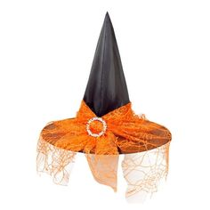 an orange and black witches hat on top of a white table