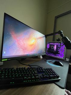 a computer monitor and keyboard on a desk