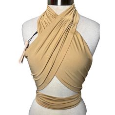 Nwt Micas Beige Tie Back Cross Halter Top Sexy Wrap One Size In A World Where Fashion Meets Function, This Micas Halter Crop Top Becomes Your Wardrobe Staple. Its Wrap Design Elegantly Embraces The Form, While The Sleeveless Cut Allows Freedom And Movement. The Beige Hue Speaks Of Sophistication, Inviting You To Weave Your Style Narrative With Grace. Wrap Design For Versatile Styling Sleeveless Halter Neck Soft, Stretchy Material Cropped Length Tie-Back Closure @Hhkcloset Tie Back Halter Top, Low Cut Halter Top, Wrap Clothes, Bnha Hero Costumes, Cross Halter Top, Leather Halter Top, Nigerian Outfits, Earth Kingdom, Drag Ideas