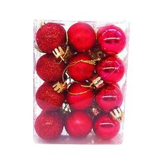 red and gold christmas ornaments in a clear box