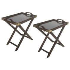 two trays with handles are sitting side by side on a white background, one is black and the other is brown