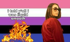 a woman standing in front of a fire with the caption if told wall i was liquid smooth smooth