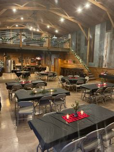 tables and chairs are set up in a large room