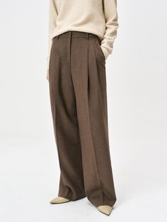 These bestselling pleated wide-leg pants from READYFI combine luxurious 60% wool blend construction with sophisticated tailoring for an effortlessly polished look. The versatile design features classic details including belt loops, diagonal front pockets, and decorative back welt pockets, while the full lining above the knee ensures comfort and structure. Available in brown, charcoal, and black colorways, these pants provide excellent warmth and styling versatility from fall through winter.Color Brown Pleated Bottoms For Workwear, Brown Wide Leg Trousers With Welt Pockets, Brown Office Pants With Pressed Crease, Brown Dress Pants With Pressed Crease For Work, Brown Wide Leg Pants With Belt Loops For Work, Tailored Brown Wide Leg Pants For Work, Classic Brown Wide Leg Pants For Business Casual, Classic Brown Wide Leg Workwear Pants, Classic Brown Wide Leg Pants For Work