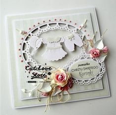 a card with some paper cut outs and flowers on the front, along with an angel ornament