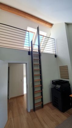 an empty room with a stair case in it