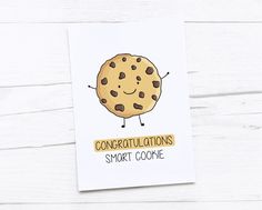 a card with an illustration of a chocolate chip cookie saying congratulationss, smart cookie