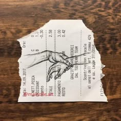 a piece of paper with a drawing of a hand reaching out for something on it