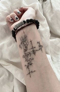 a woman's arm with a tattoo on it