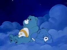 two blue teddy bears sitting in the clouds with one holding a gold ring and the other looking up at the sky