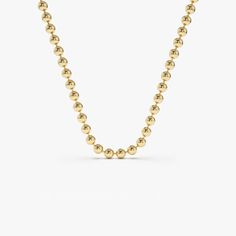 This 14k gold beaded ball chain is a simple and stylish accessory. Measuring 2mm in width, it's delicate enough to be worn alone or layered with other necklaces for a trendier look. The 14k gold construction guarantees that this chain will last for years to come, making it a timeless piece to add to your jewelry collection. ▶ Item Details * Made to Order * Gold Kt: 14K Solid Gold * Width of Chain: 2MM * Ready to Ship in 3-5 Business Days ▶ See more of our Gold Bracelets here - http://etsy.me/2l9VKBr ▶ See our storefront here - http://etsy.me/2lUcVnH  ▶ All store sections here * Diamond Rings - http://etsy.me/2lwKUl8 * Diamond Earrings - http://etsy.me/2lyqVBP * Diamond Necklace - http://etsy.me/2mqa6O1 * Diamond Bracelets - http://etsy.me/2mVrAB5 * Diamond Wedding Rings - https://etsy.me/3 Classic Beaded Chain Necklace With Round Beads, Minimalist Ball Chain Necklace With Round Beads, Yellow Gold Beaded Chain Necklace With Round Beads, Everyday Beaded Necklaces With Round Ball Chain, Yellow Gold Satellite Chain Necklace With Round Beads, Gold Ball Chain Necklace With Round Beads, Gold Ball Necklace, Style Theory, Gold Ball Chain