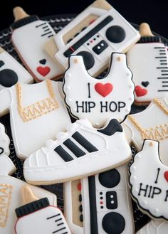 decorated cookies in the shape of tennis shoes and sneakers with i love hip hop written on them