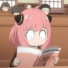 an anime character reading a book with other characters behind her