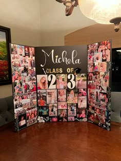 a table with pictures on it in front of a large sign that says micha class of 2013