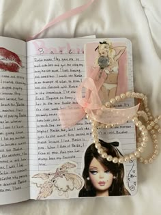 an open book with pictures and pearls on it