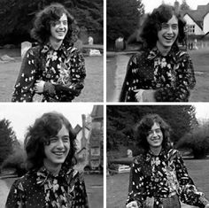 black and white photo of woman in flowered shirt smiling at the camera with her hands on her hips