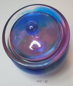 Beautiful hand poured resin storage crock. Dark blue with undertones of of pink, green and clear.  Works well for jewelry (great presentation box for that special piece of jewelry), office supplies, or even for snacks.   Lid sits nicely on top of the crock Liquid capacity is 1/2 cup. Resin Container Ideas, Resin Organizer, Resin Makeup Organizer, Resin Jars With Lids, Jewelry Office, Mushroom Jar Resin, Resin Storage, Great Presentations, Jewellery Storage